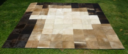 Random tricolor cowhide rug