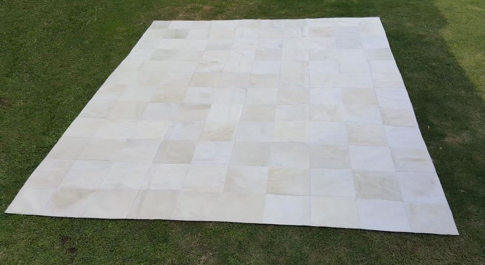 white patchwork cowhide rug